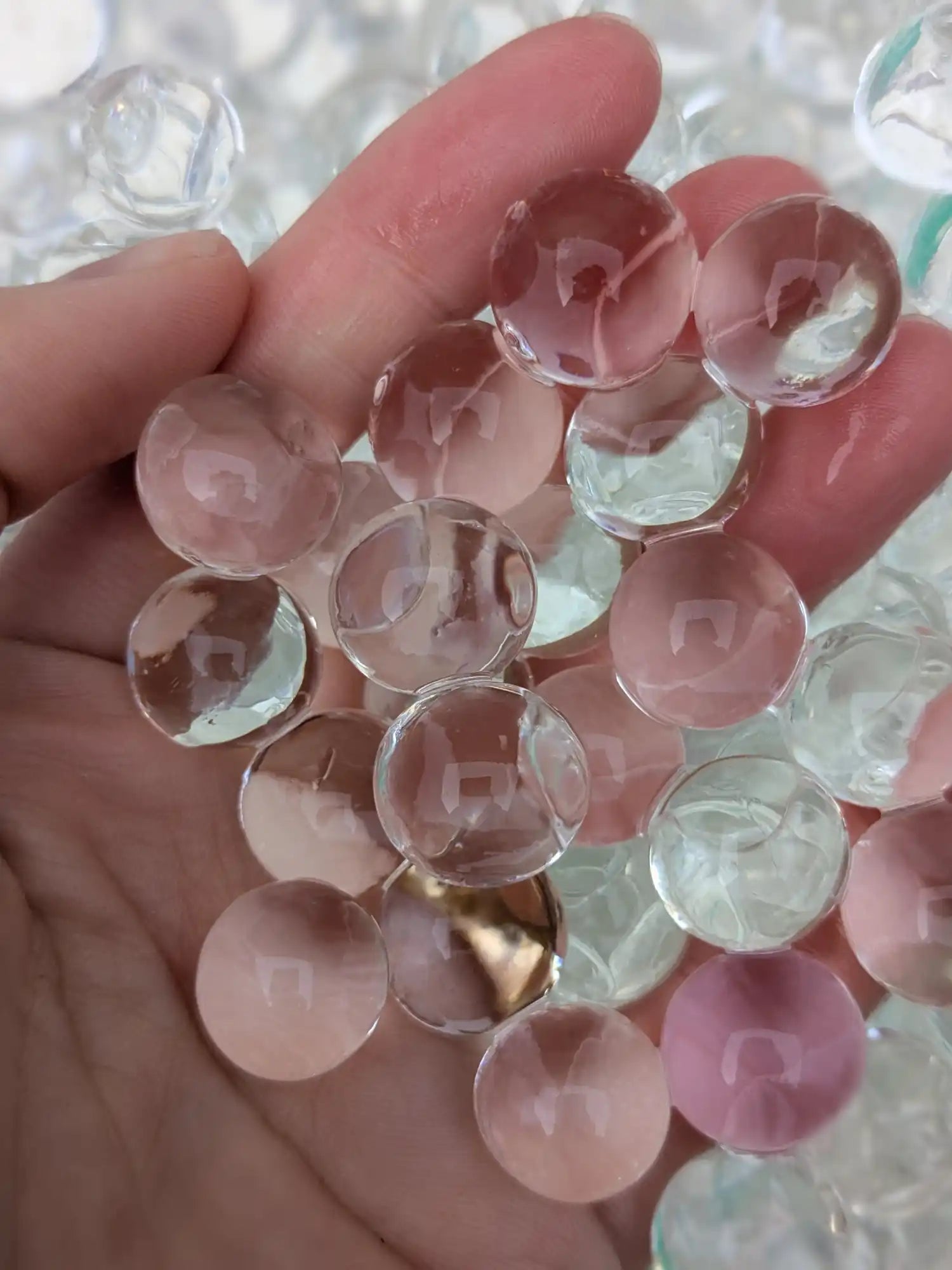 Handful of translucent water beads.