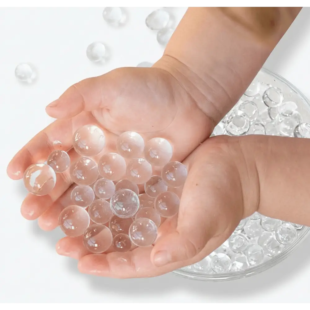 Hands holding jumbo clear waterbeads