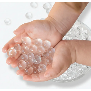Hands holding jumbo clear waterbeads