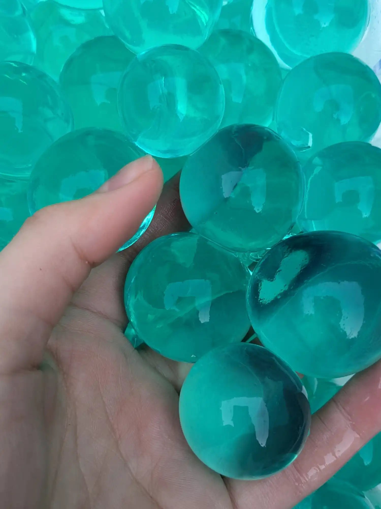 Translucent turquoise water beads.